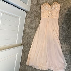 Prom Dress. Size 4. Worn once. Dry cleaned. Peach color.